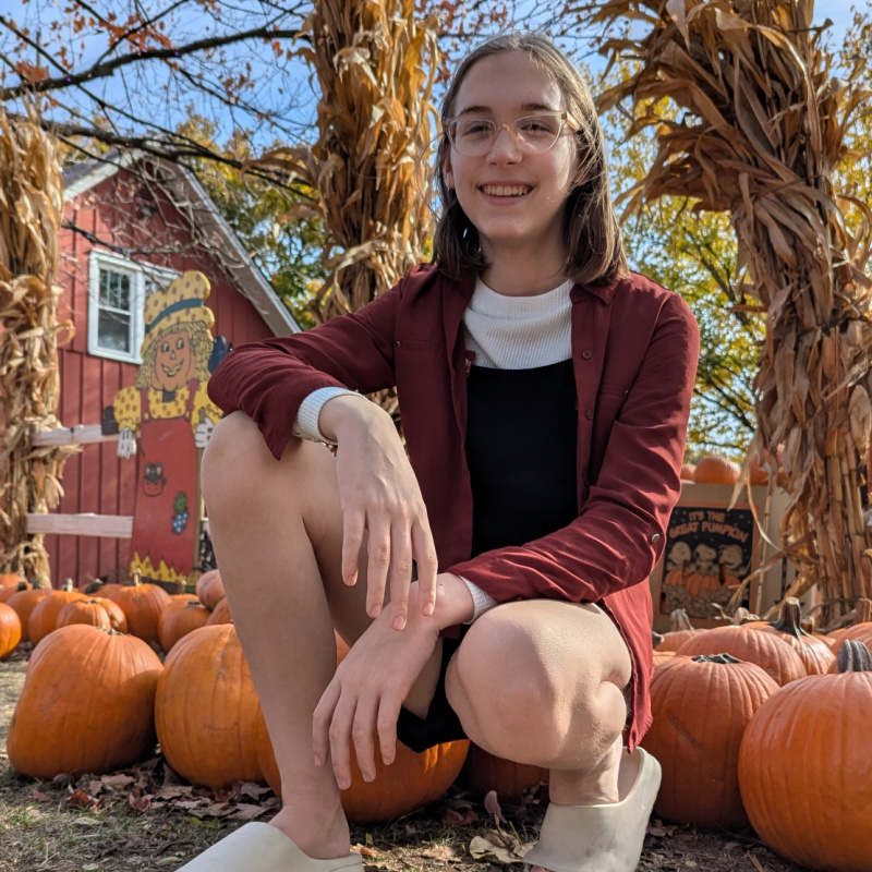 bri sitting with pumpkins